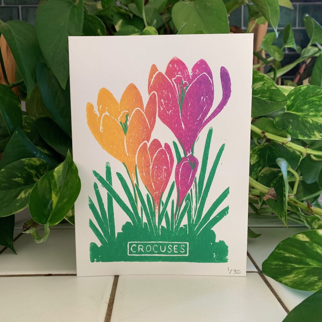 Linocut printmaking card of crocus flowers for Earth Day, 2023, by Corey Waurechen.